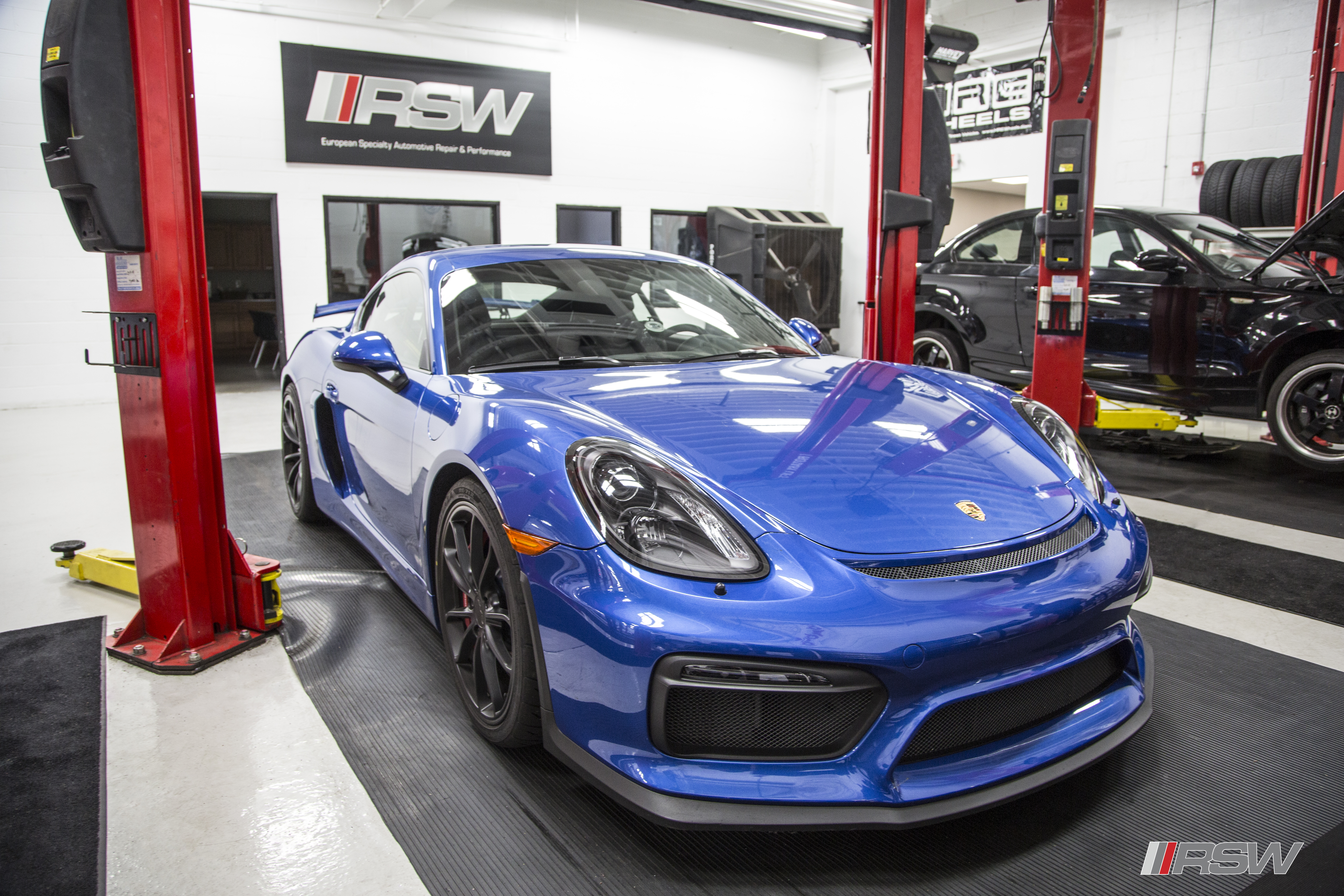 Blue Porsche Cayman GT4 in the RSW Euro shop