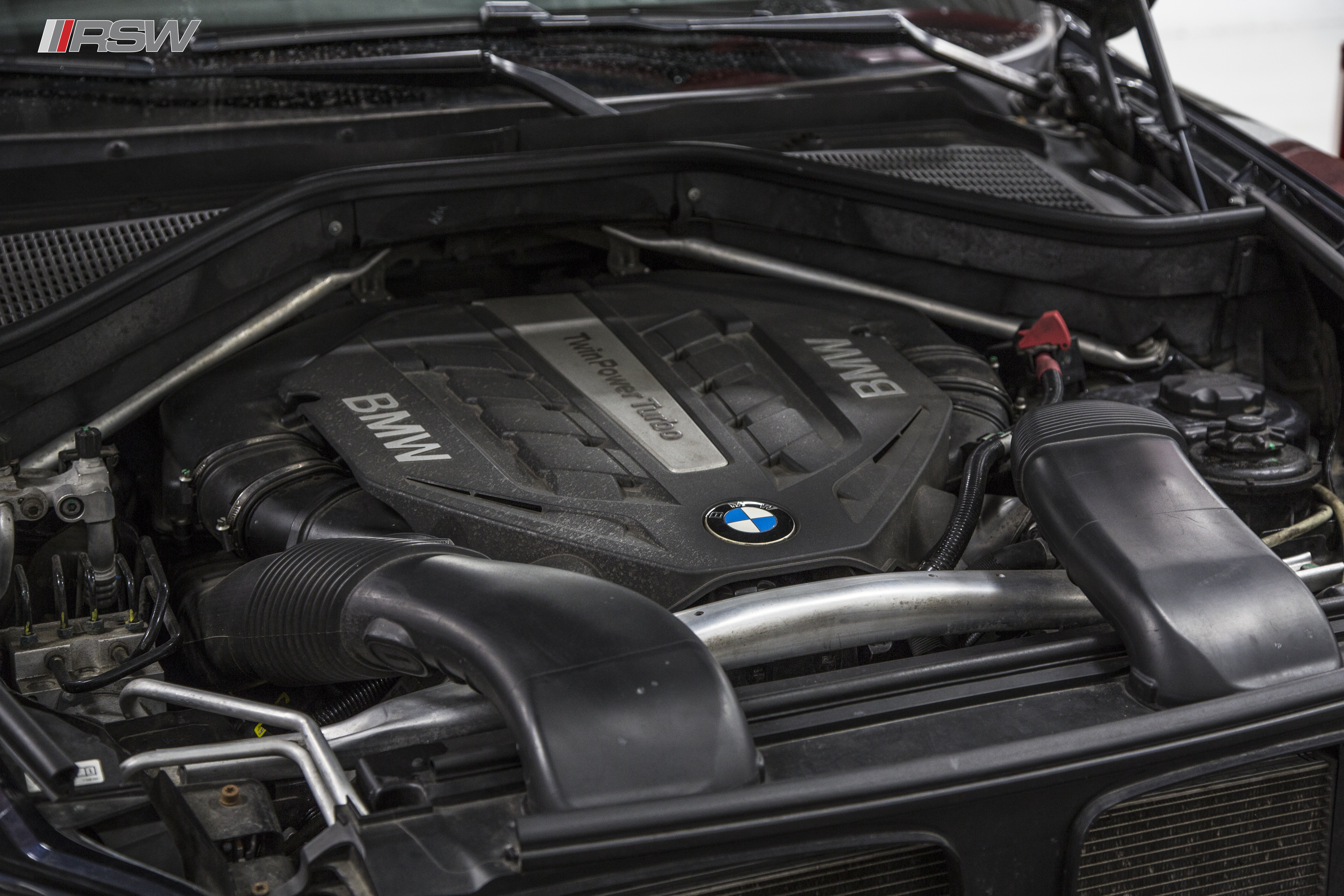 Engine cooling line and fitting during service at RSW Euro