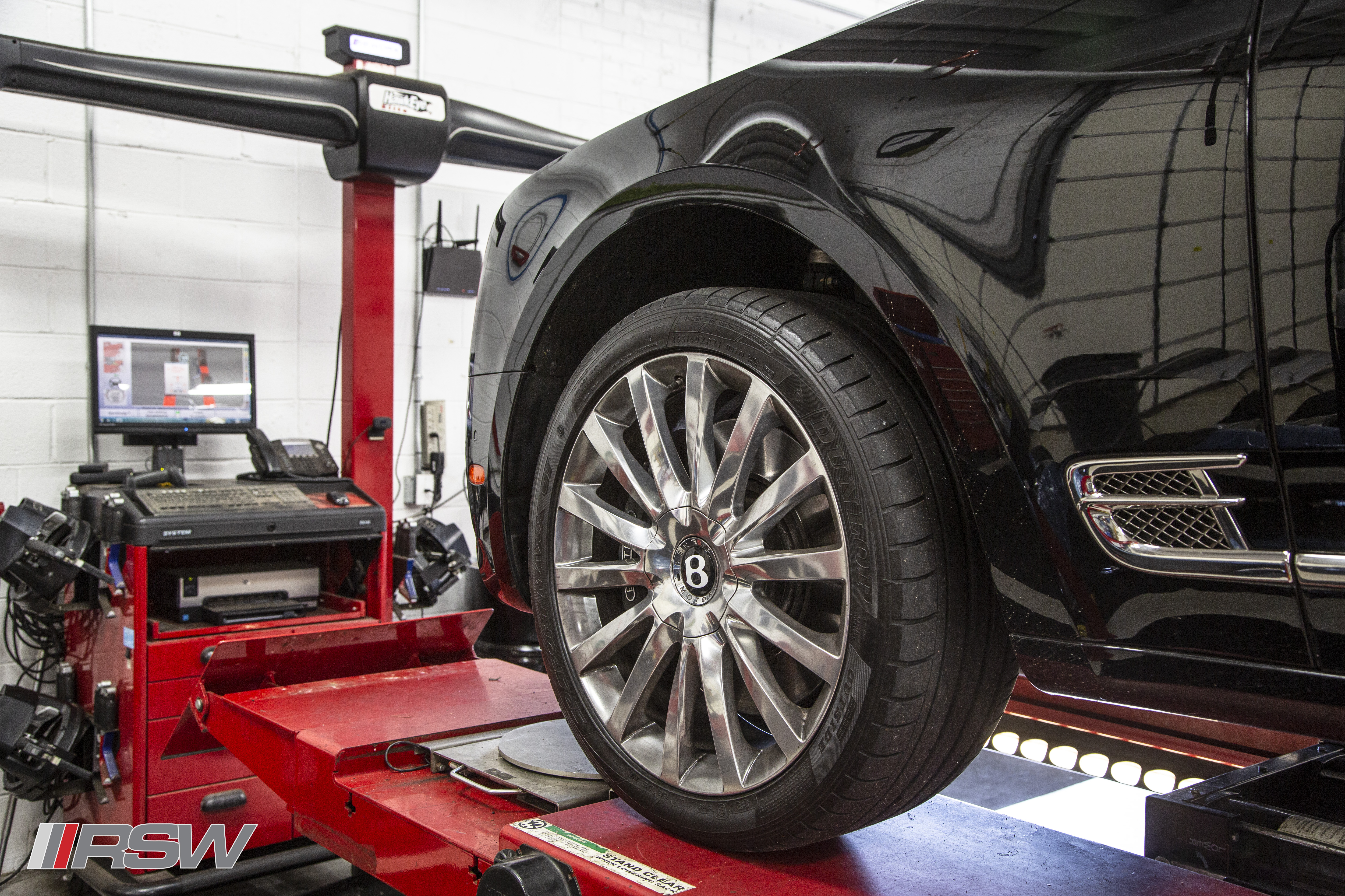 Bentley wheel on the alignment rack at RSW Euro