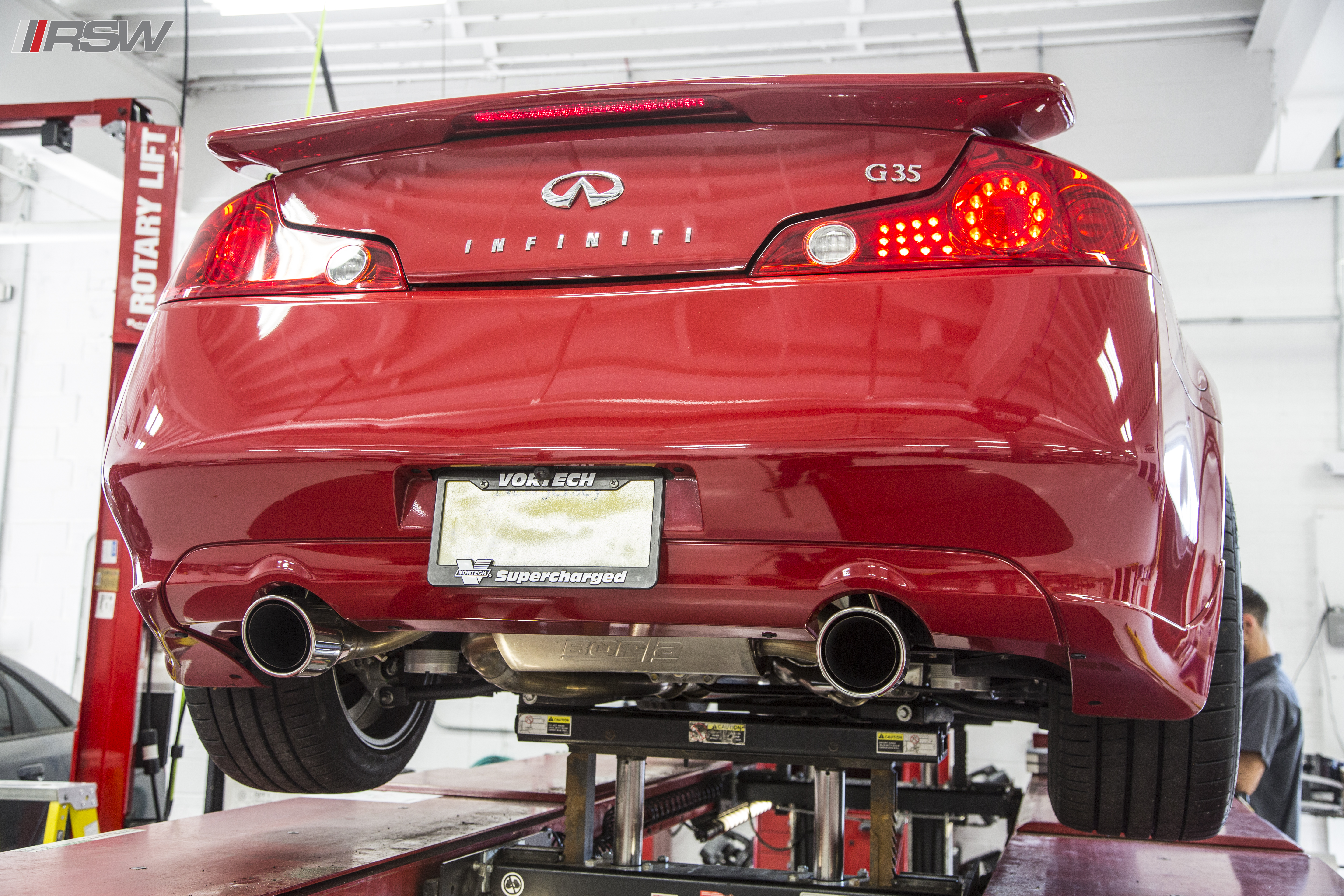 Red Infiniti G35 on the lift in the RSW Euro shop
