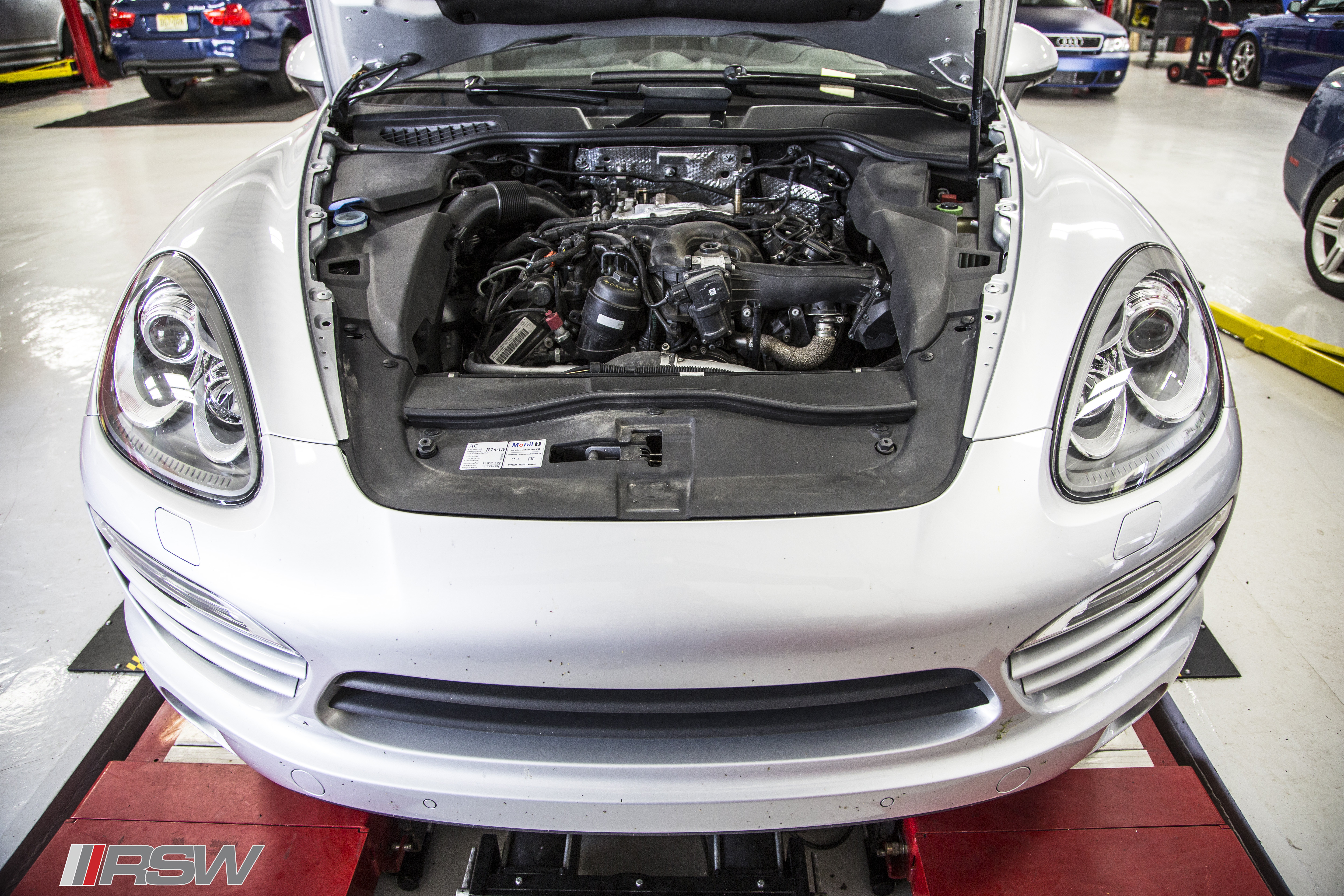 White Audi with the hood open at RSW Euro in Green Brook