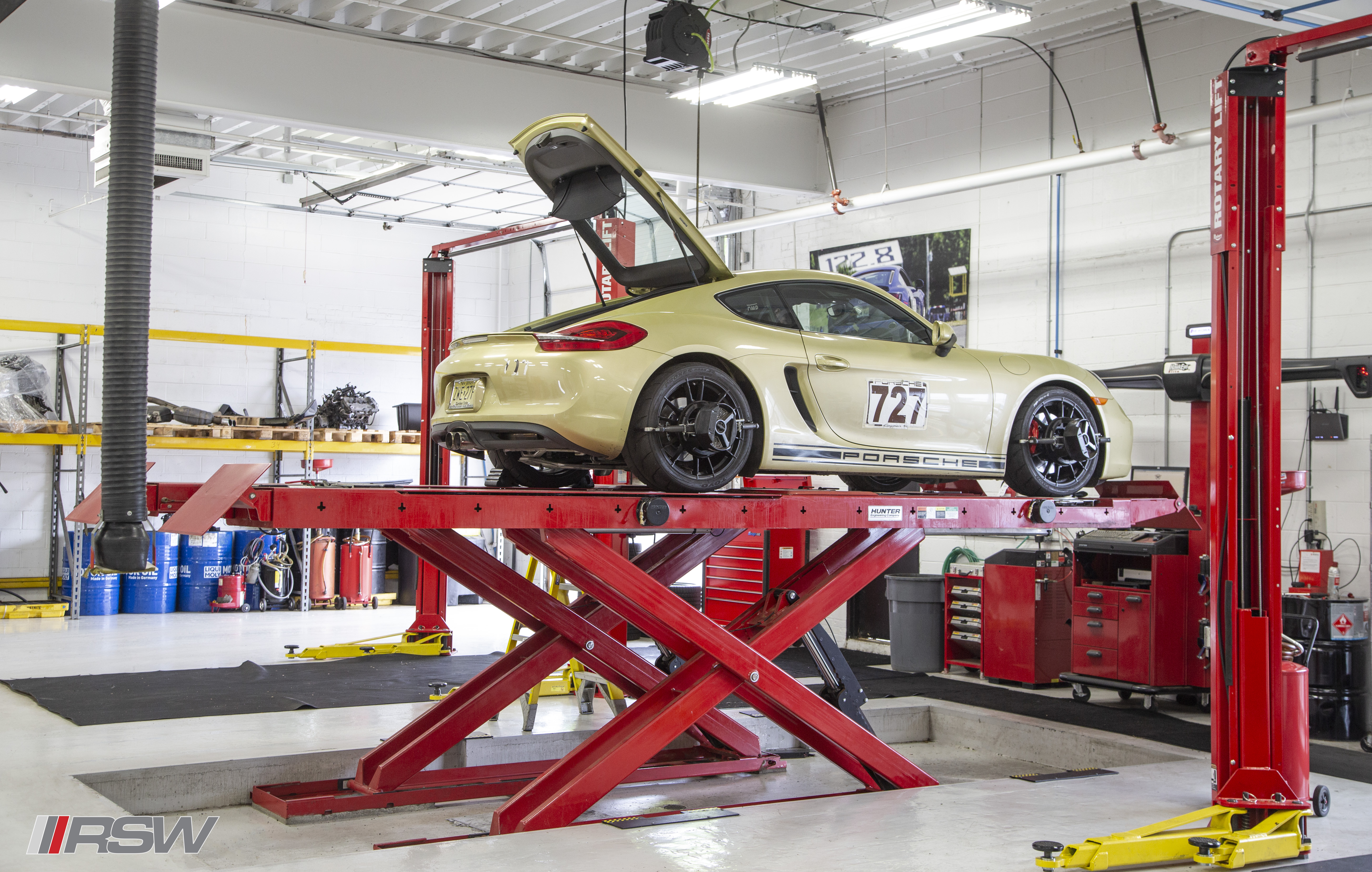 Porsche wheel and tire on a lift at RSW Euro in Green Brook