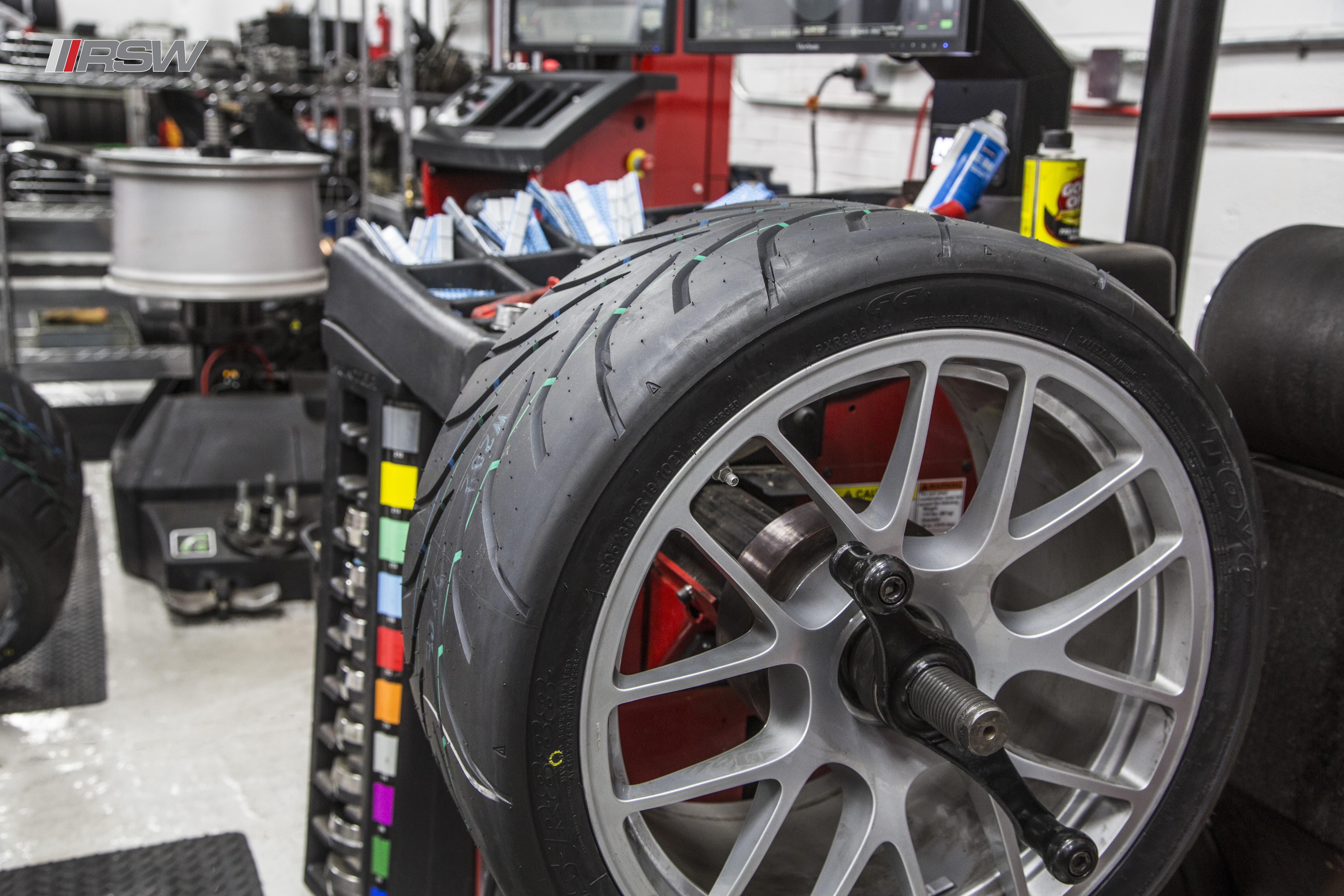 Audi wheel and ceramic brake on a lift at RSW Euro